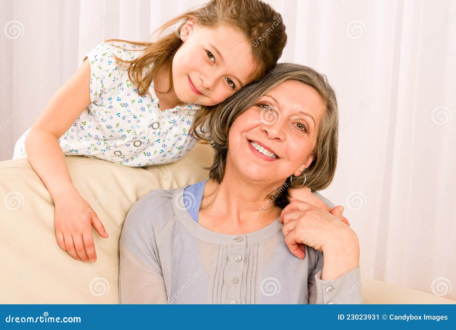 Grandmother with young girl smile relax together. Grandmother with young girl smiling relax together on sofa