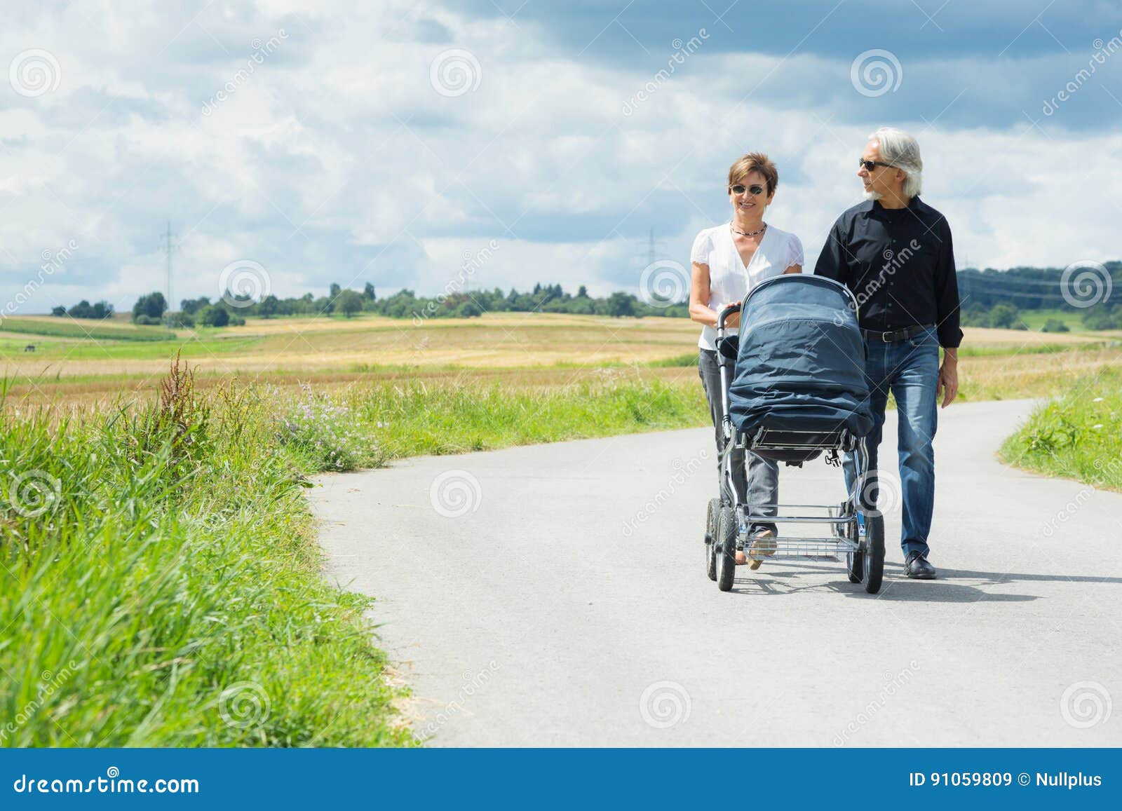 Grandparents Going for a Walk with Baby Stroller Stock Image Image of