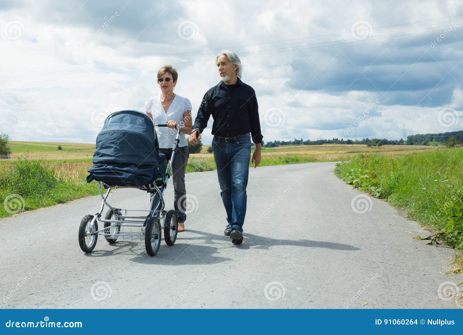 Grandparents Going for a Walk with Baby Stroller Stock Photo Image of