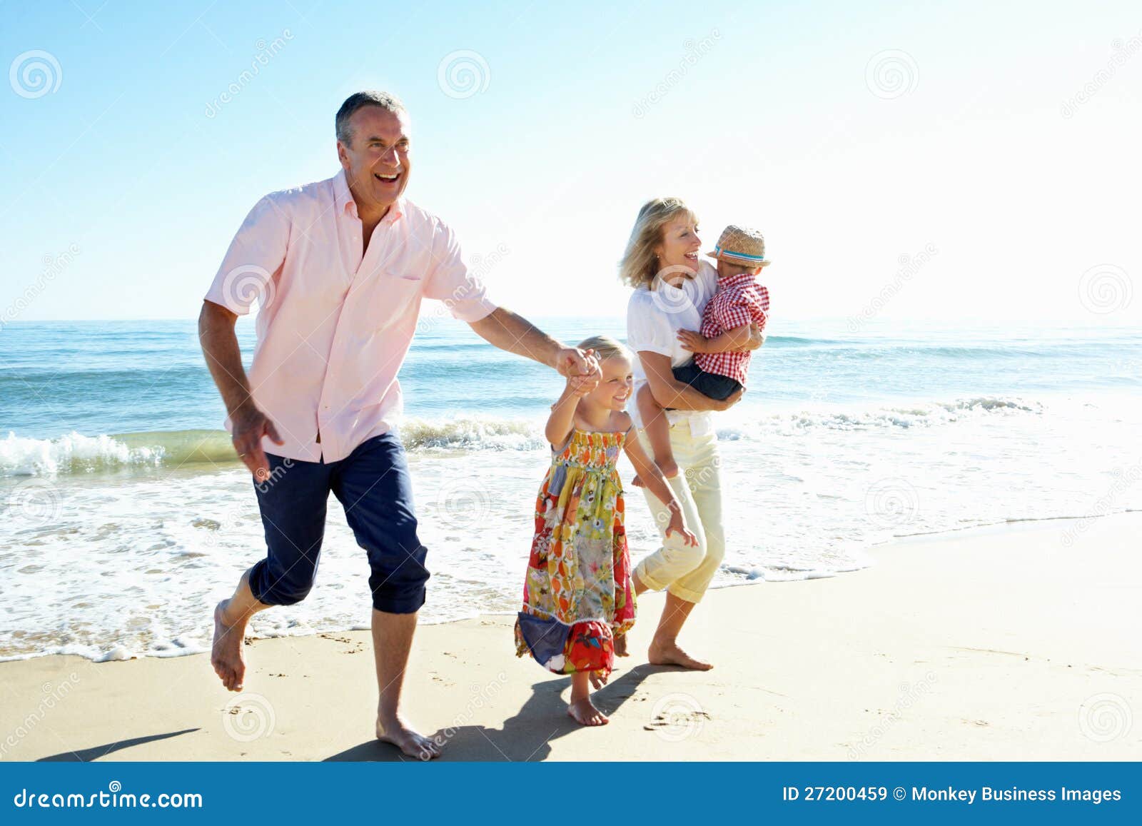 grandparents and grandchildren on beach