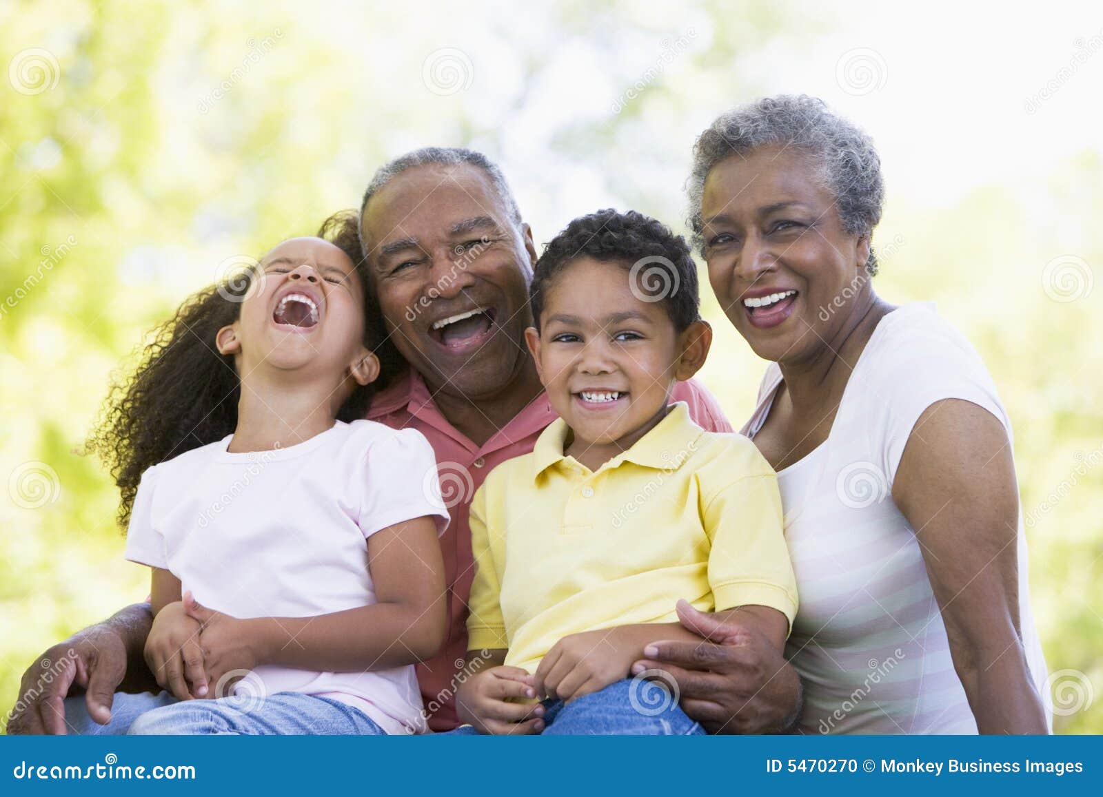 grandparents laughing with grandchildren