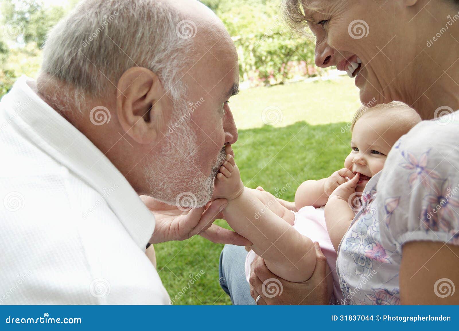 grandparents playing with granddaughter