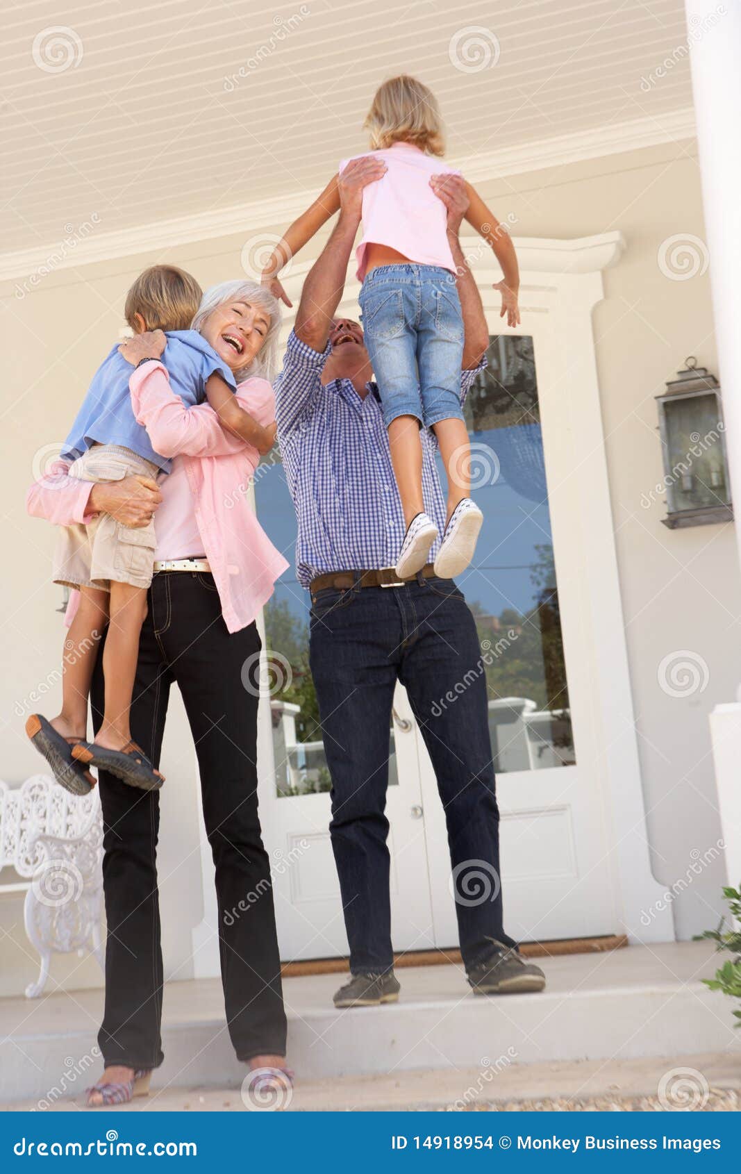 grandparents welcoming grandchildren on visit