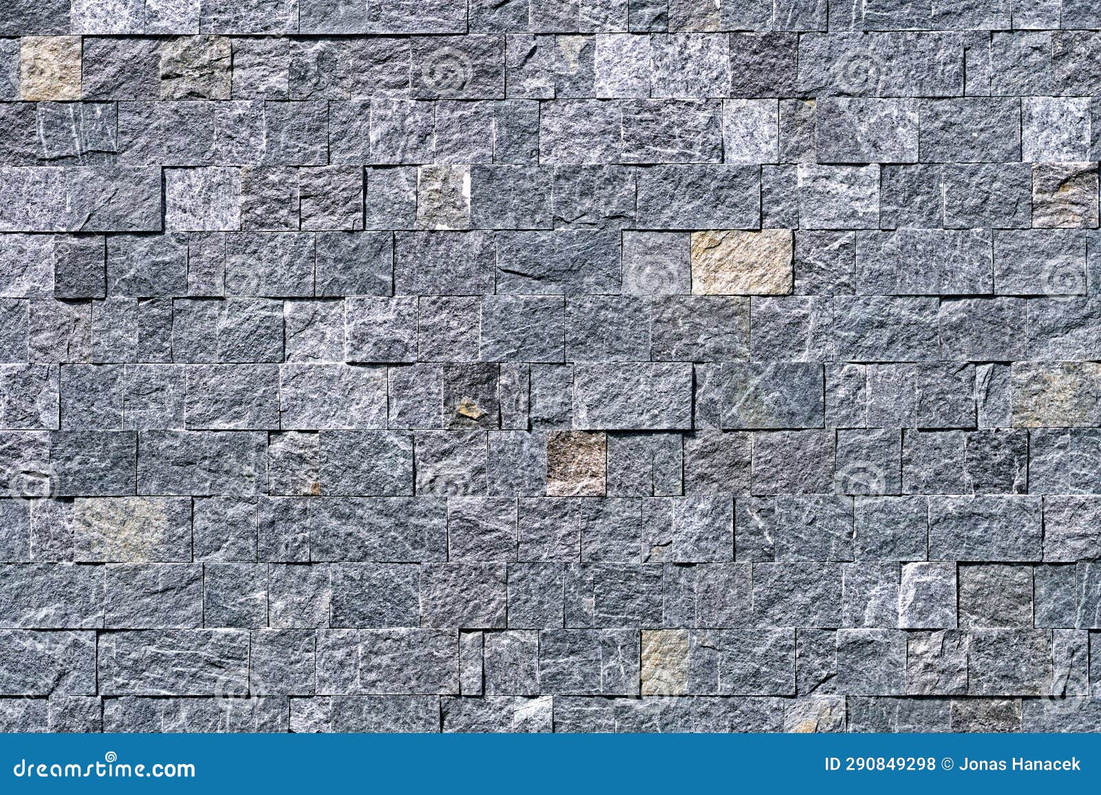 Granite and Stone Bricks and Tile Facing on the Building. Stock Photo