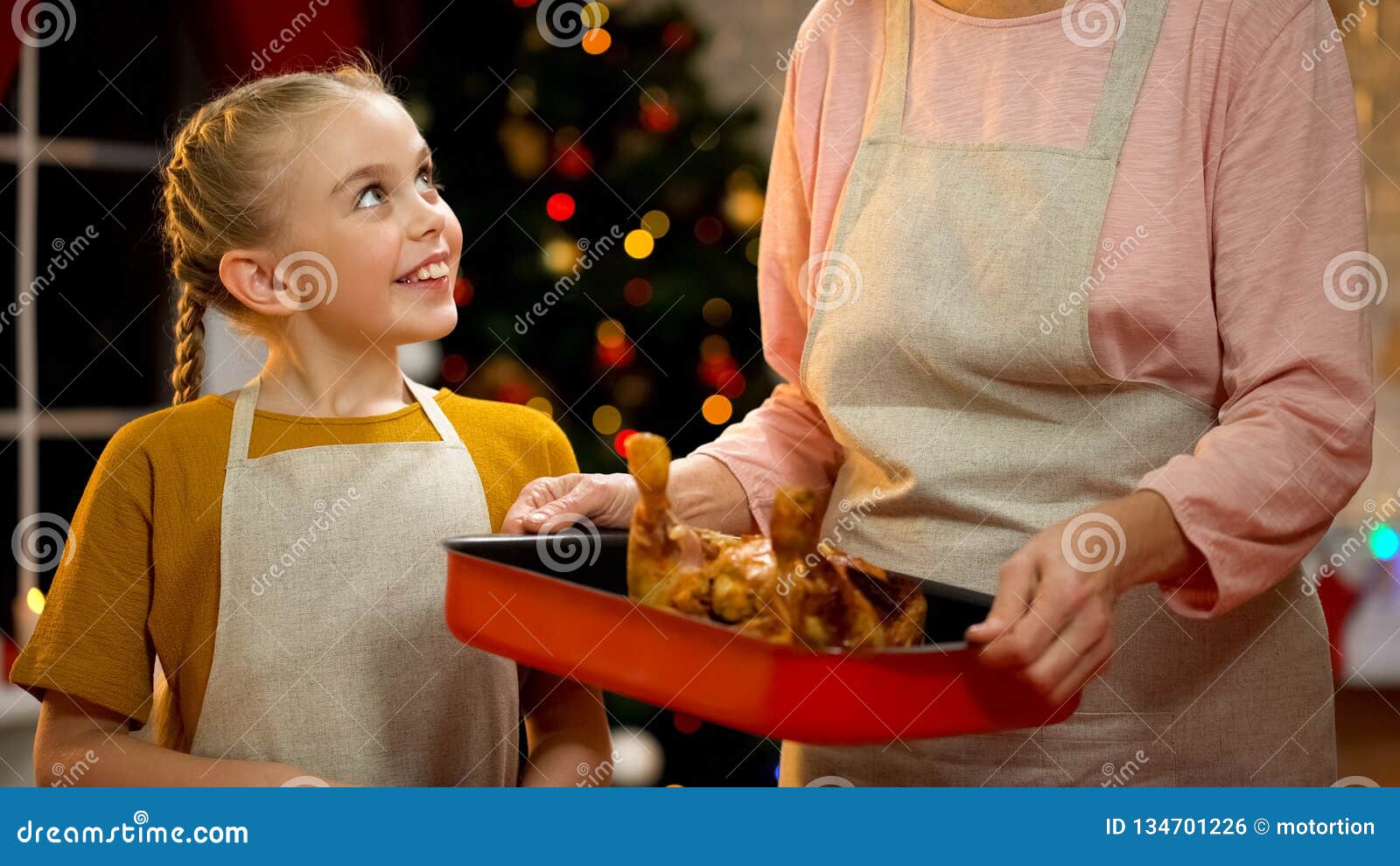 Granny Showing Little Girl Spicy Roasted Xmas Chicken, Preparations for ...