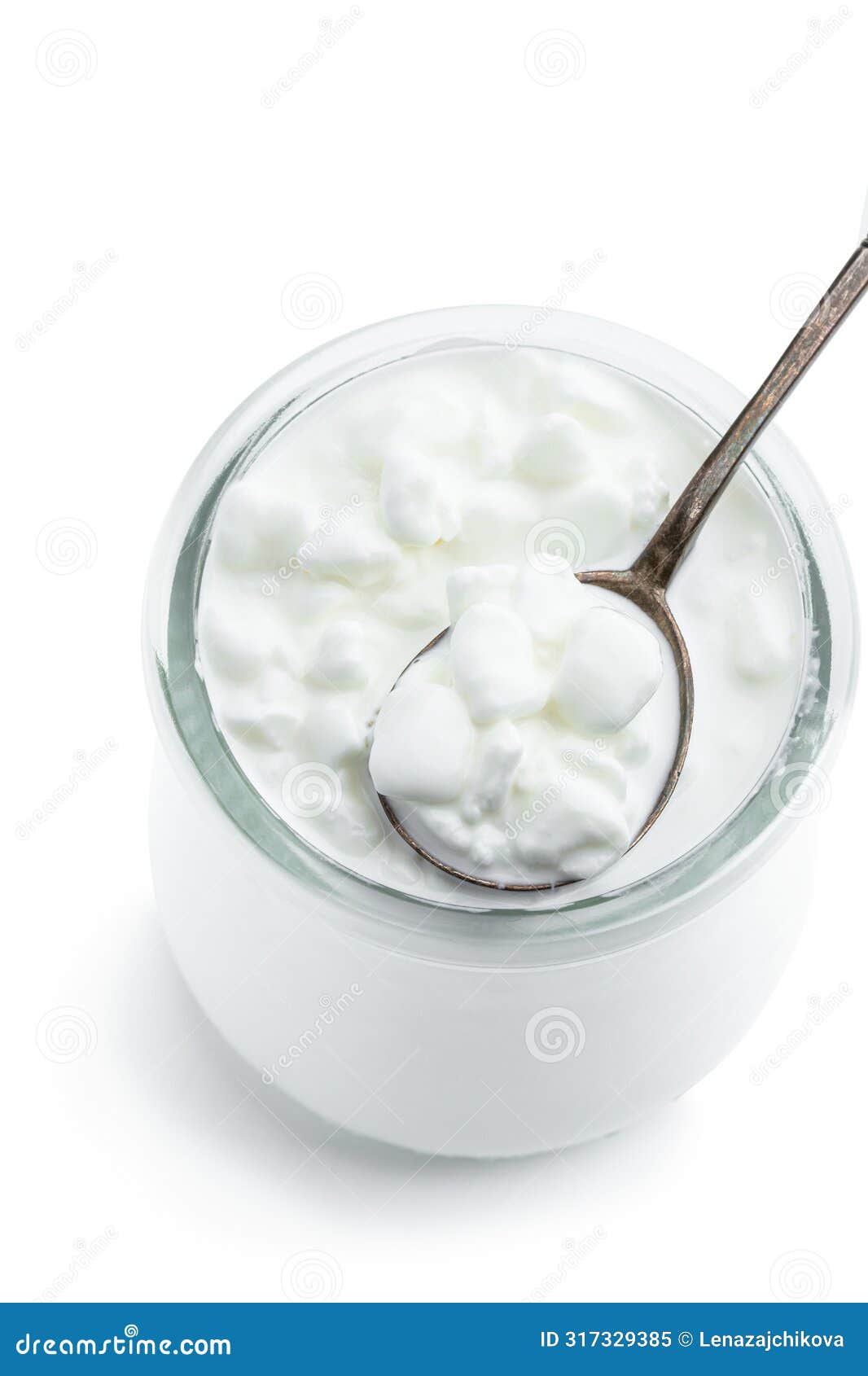 granular cottage cheese with cream in a glass jar  on white