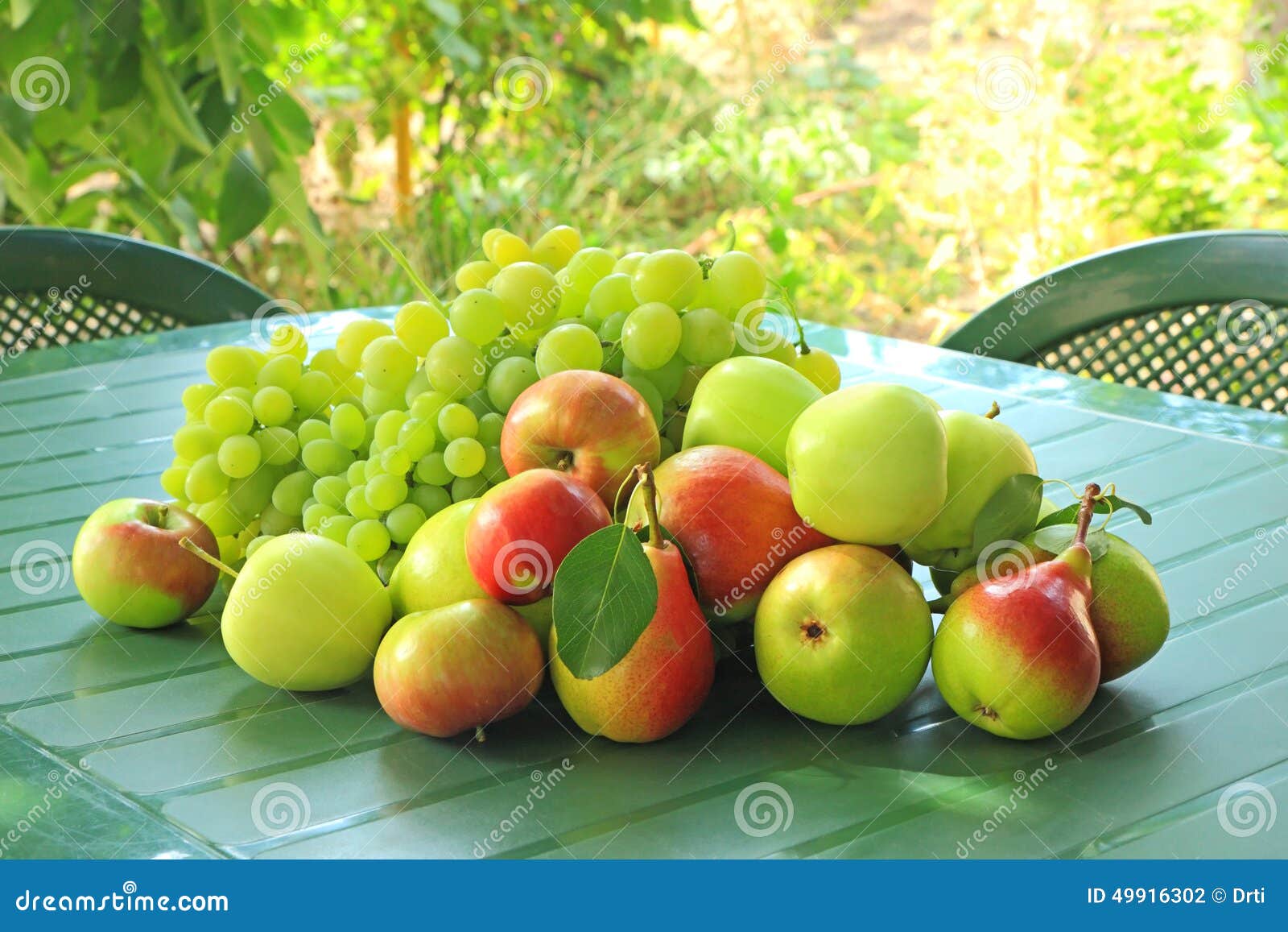 Grapes, Apples and Pears on a Table Stock Photo Image of background