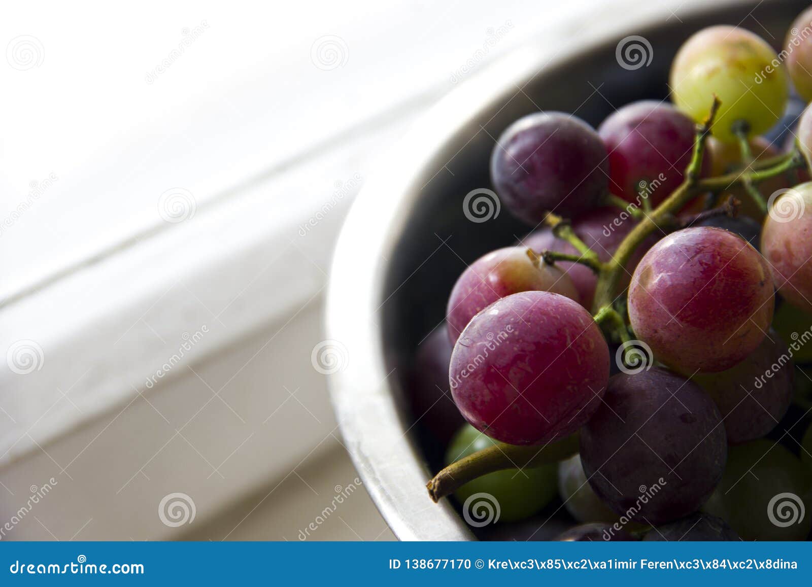 Grapes in a Bowl Near the Window Stock Photo - Image of bright, silver ...