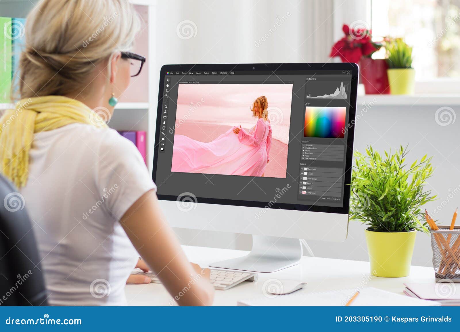 graphic  artist editing photo on computer