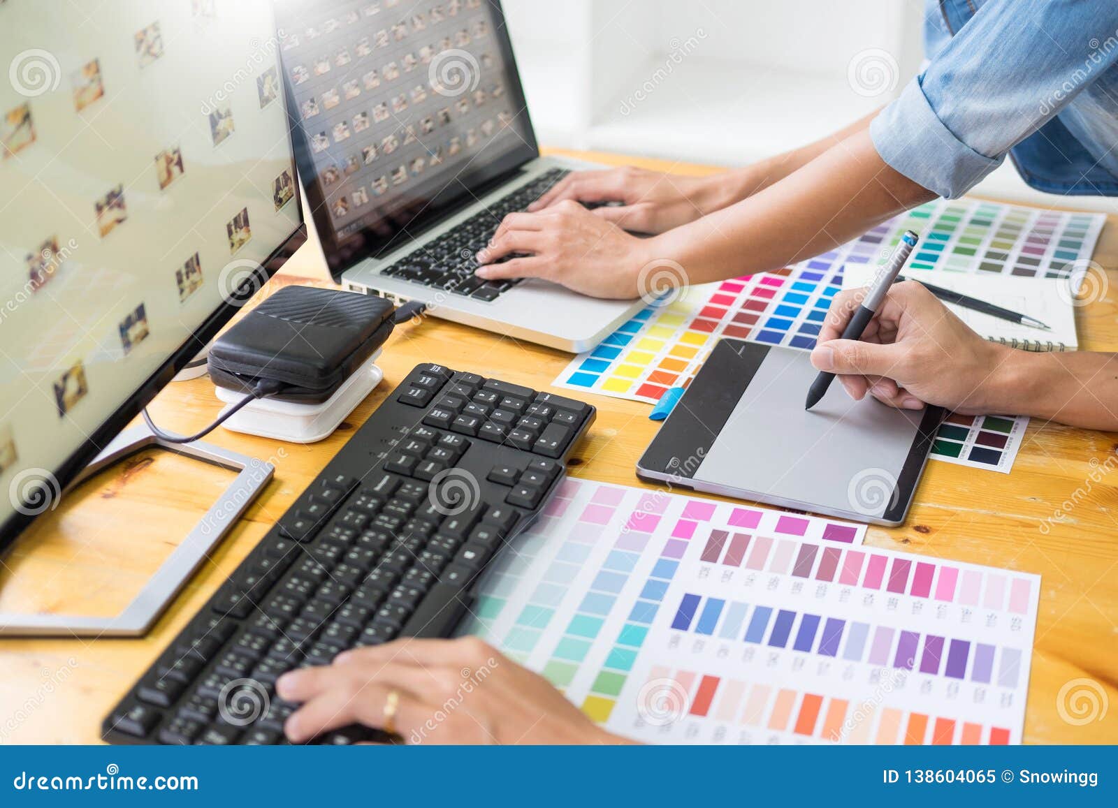 Graphic Designer Team Working On Web Design Using Color Swatches