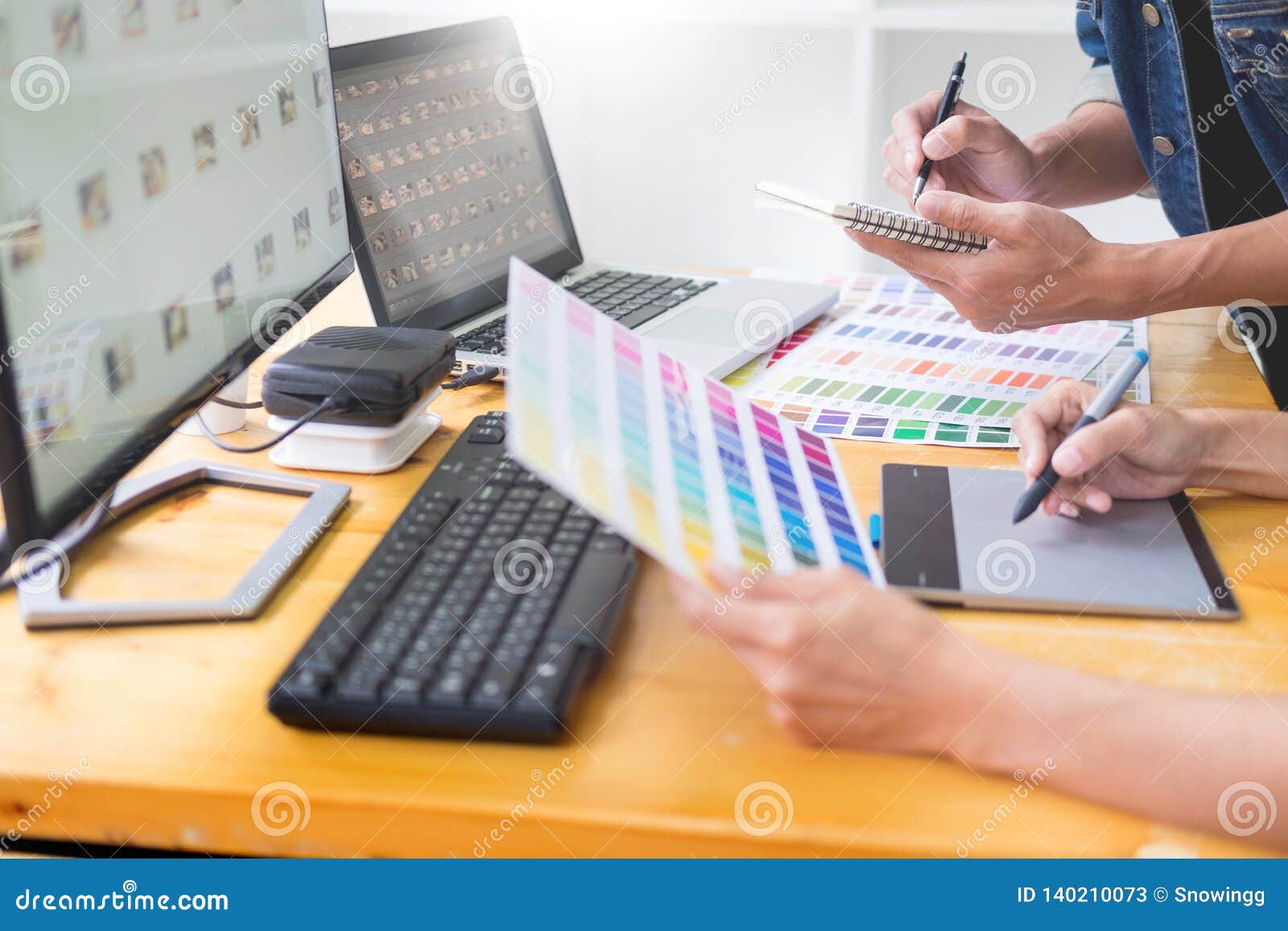 Graphic Designer Team Working On Web Design Using Color Swatches