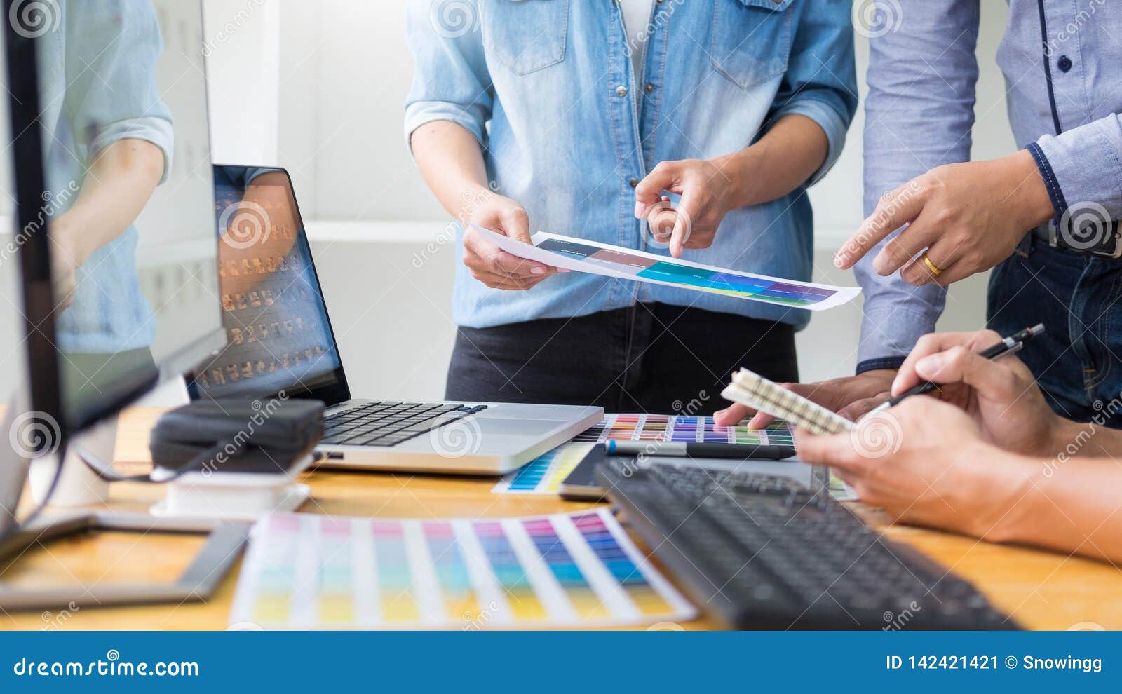 Graphic Designer Team Working On Web Design Using Color Swatches