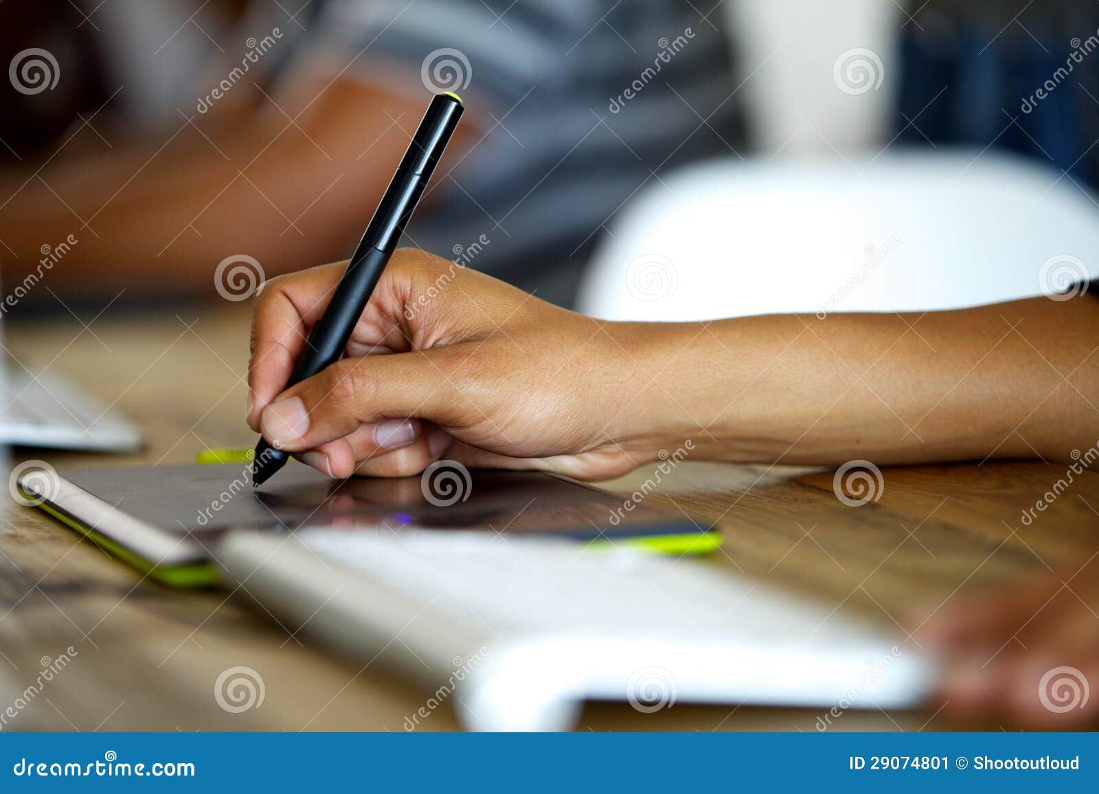 Graphic designer using tablet. Hand of a graphic designers while using a stylus.