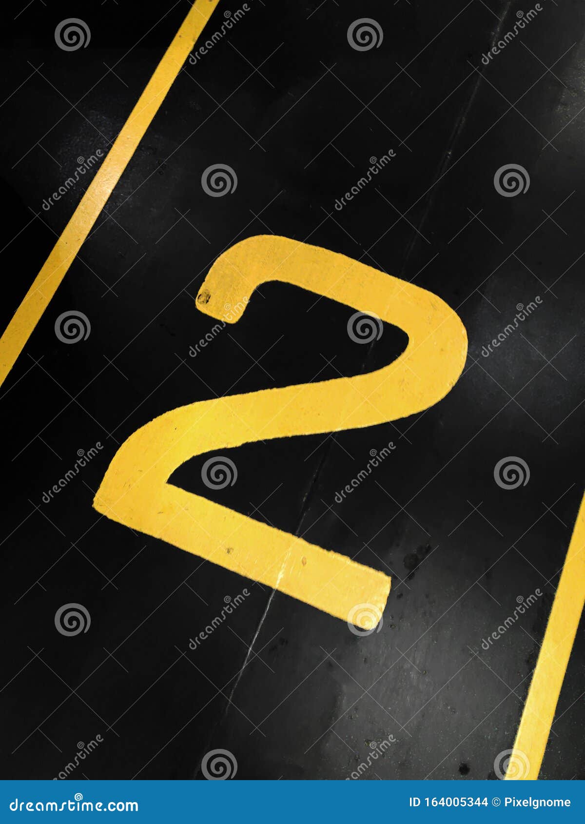 graphic yellow numbers painted on a stark black background
