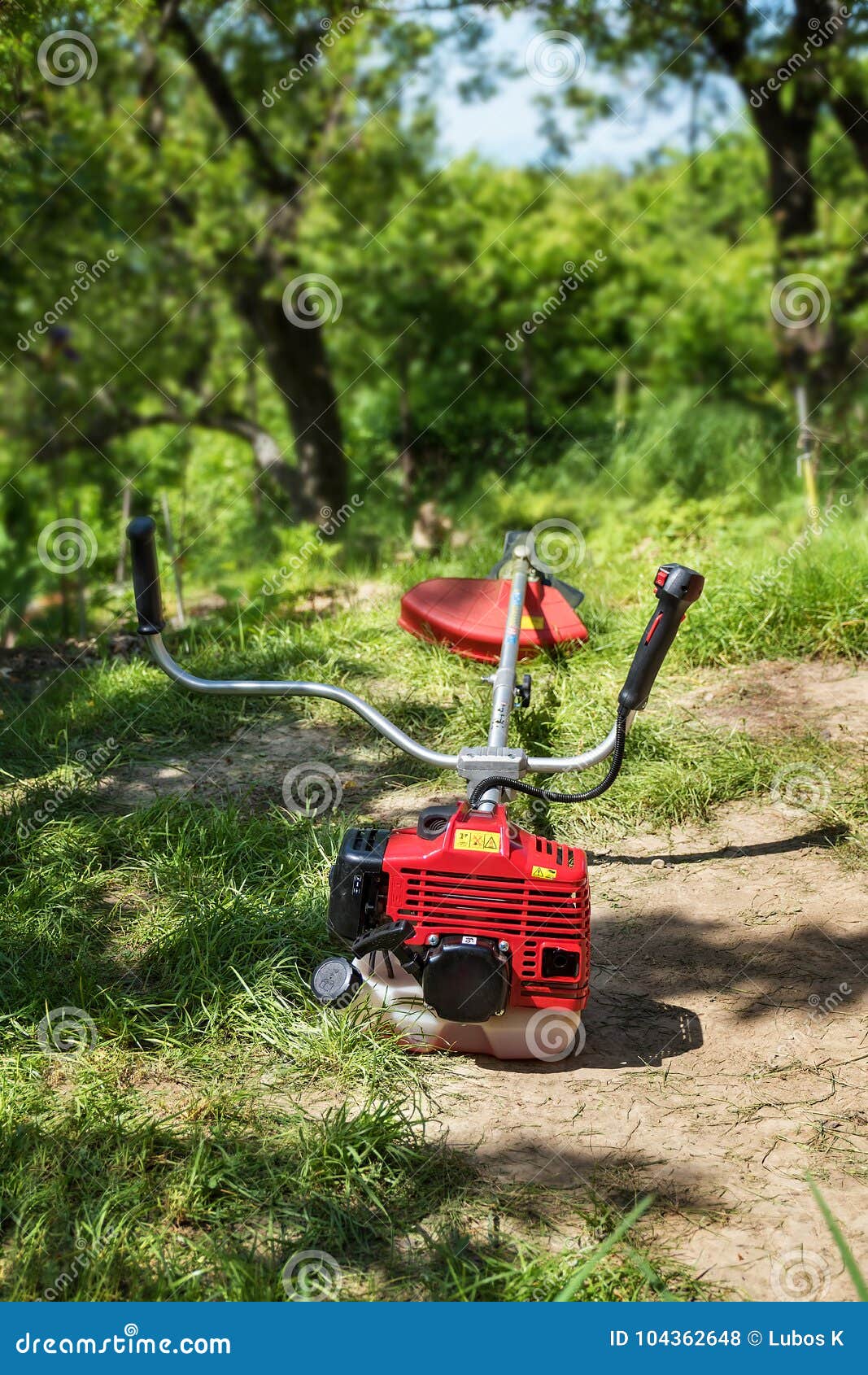 Grass Cutter / Brush Cutter for Trimming Overgrown Grass Stock Photo