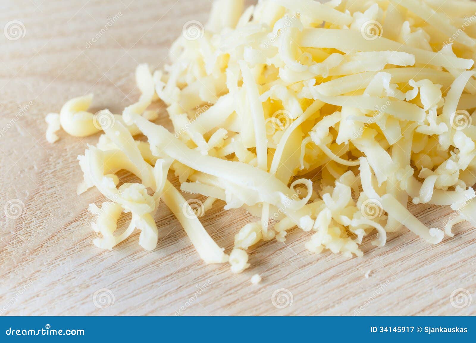 Grated cheddar cheese stock image. Image of fresh, grated 34145917