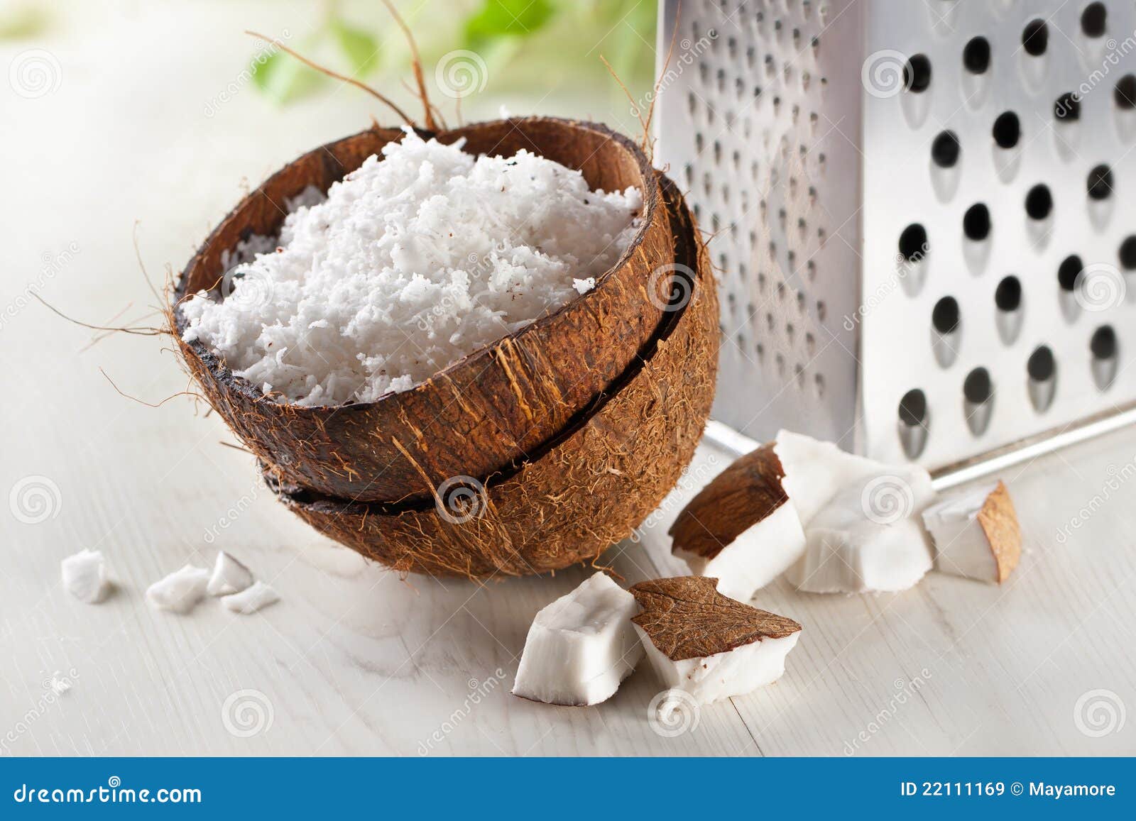 Grated coconut with grater stock image. Image of dessert 22111169