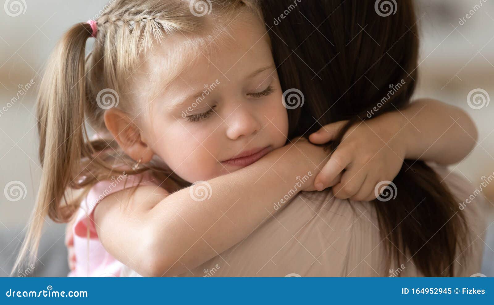 grateful little child girl cute face embrace loving foster mother