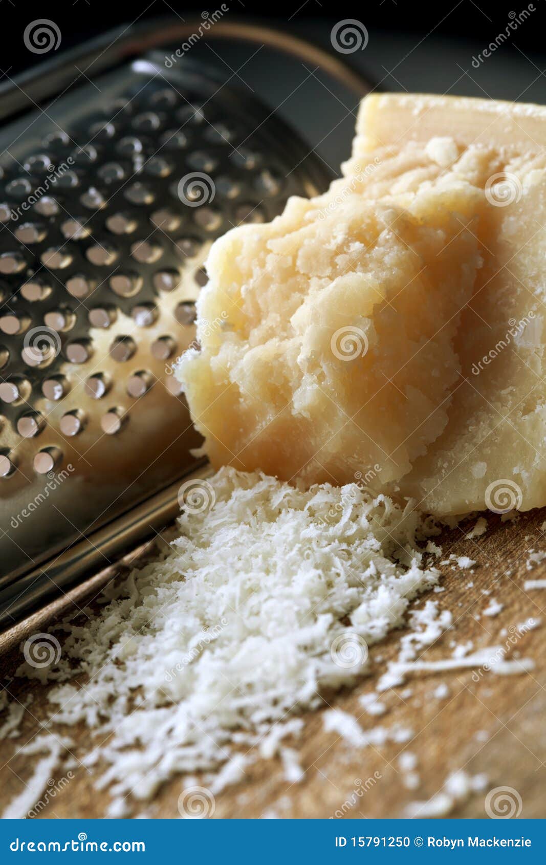Grating Parmesan Cheese stock photo. Image of parmesan 15791250