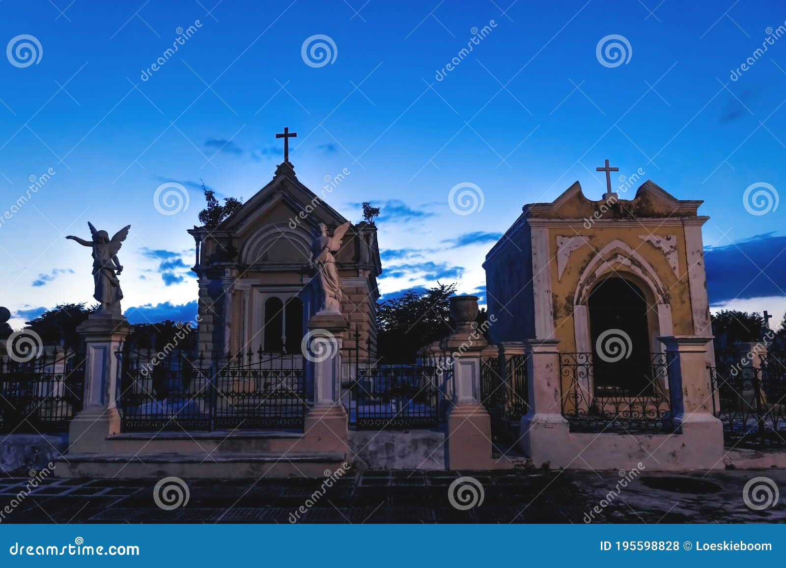 graveyard tombs with crosses and angel statues at the cemetery `cementerio general` in merida, yucatan, mexico
