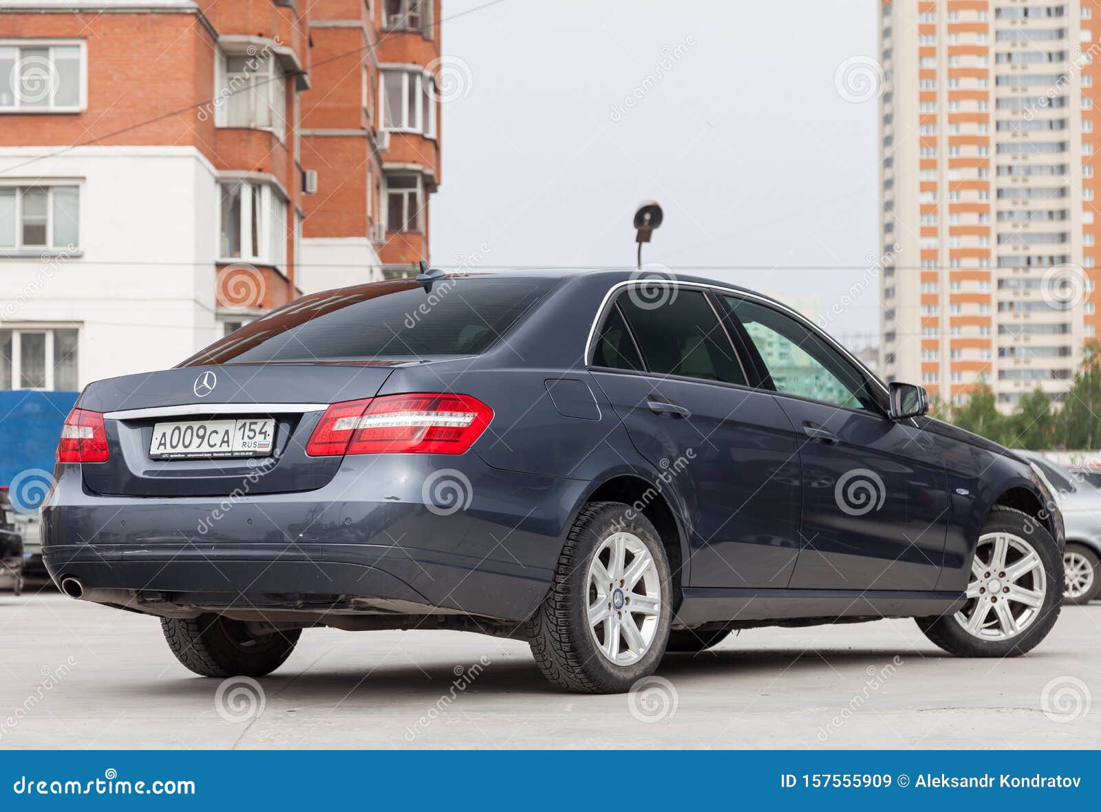 Gray And Blue Mercedes Benz E Class E200 2010 Year Rear View