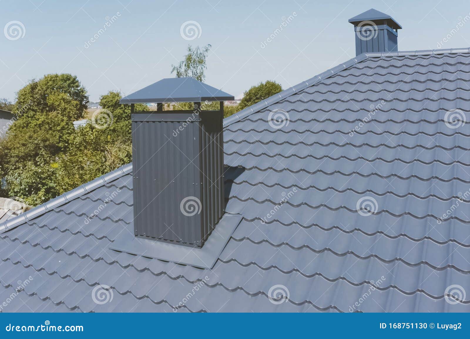 Grayblue Metal Roof Tiles On The Roof Of The House 