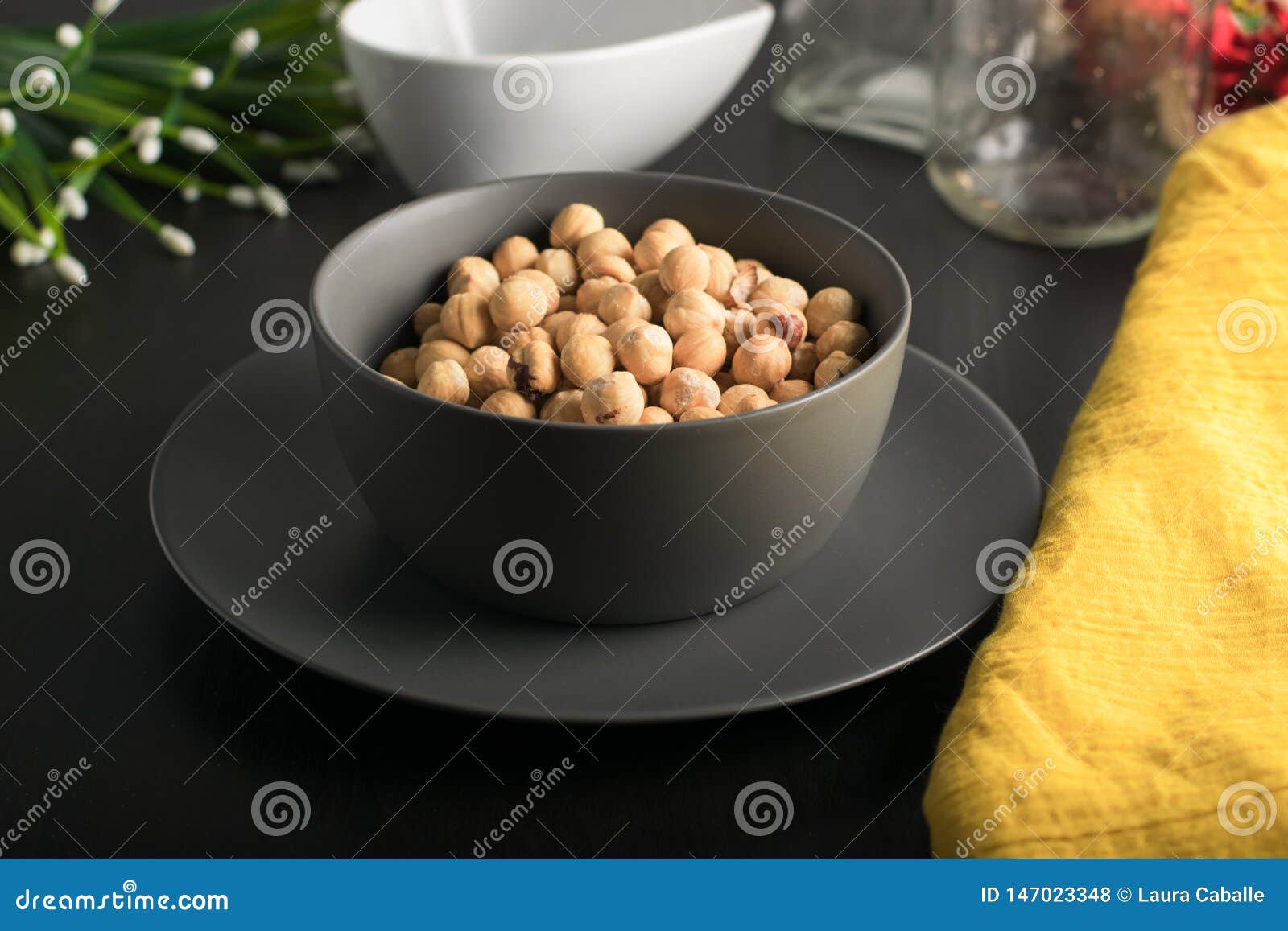 gray bowl with  hazelnuts