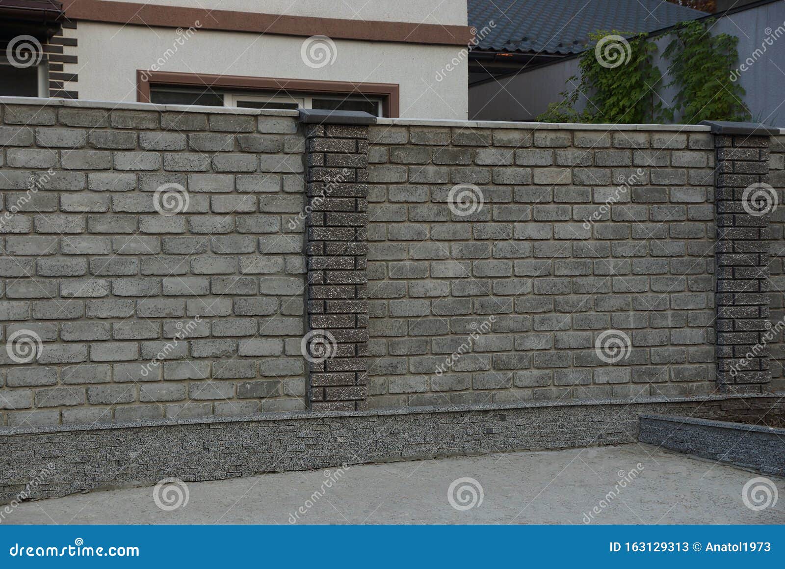 brick fence on a rural street