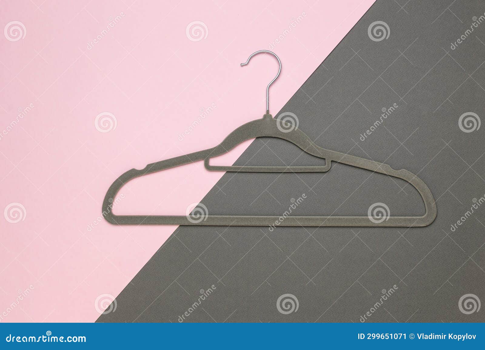 A Gray Clothes Hanger on a Pink and Gray Background Stock Image Image