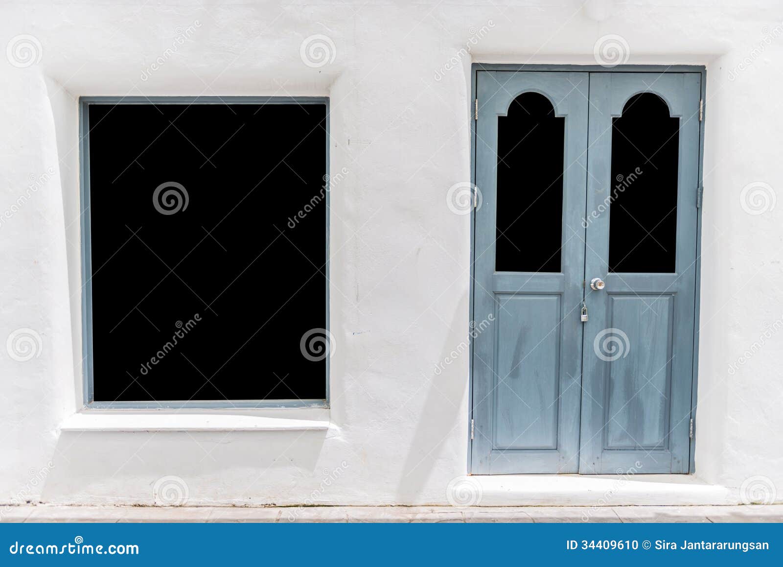 Gray door on white wall stock photo. Image of cement 34409610