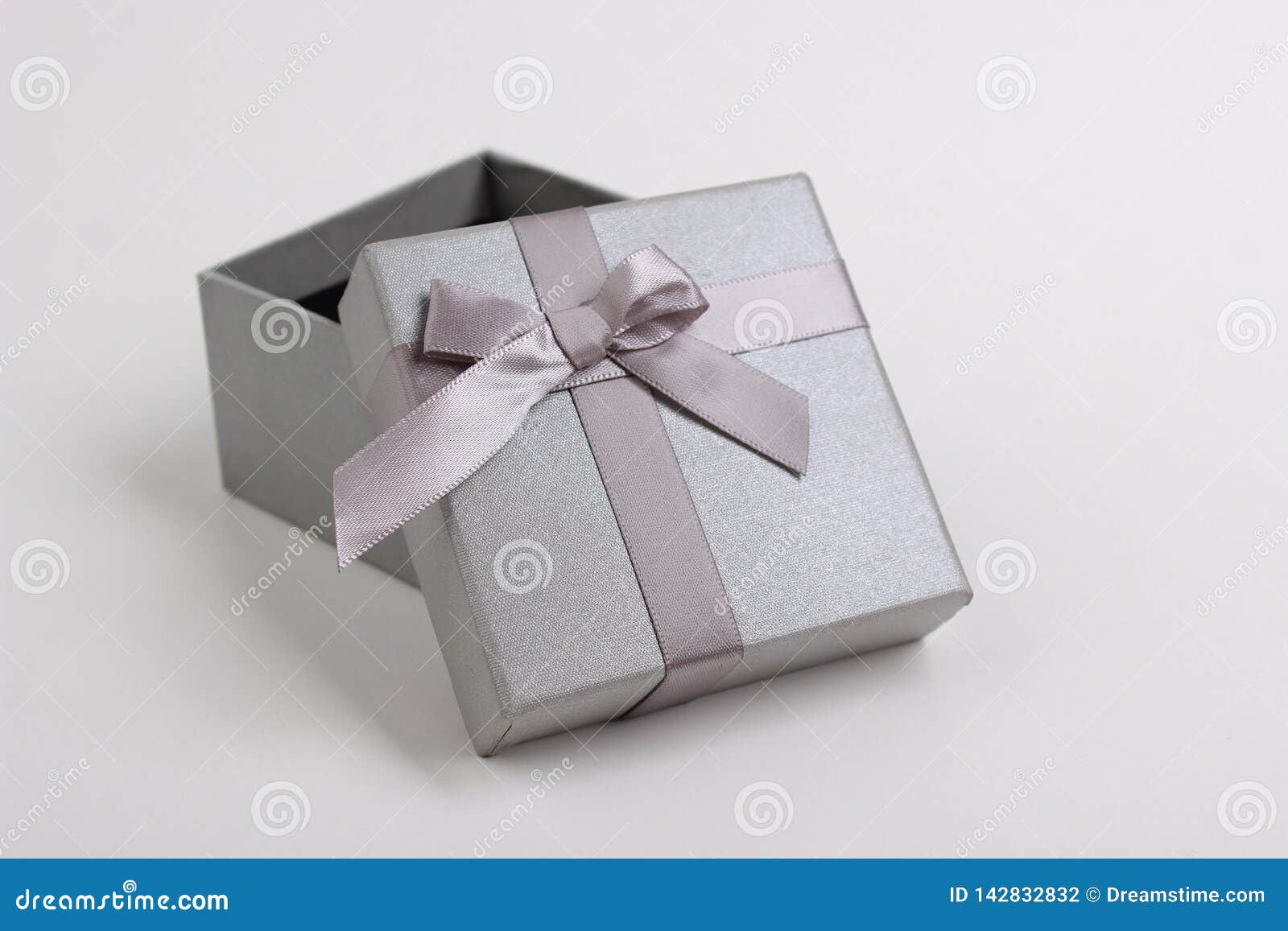 Gray gift box with a bow stock photo. Image of present 142832832