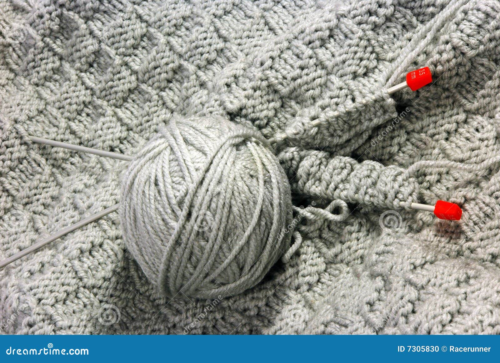 Gray knitting with needles stock photo. Image of isolated 7305830