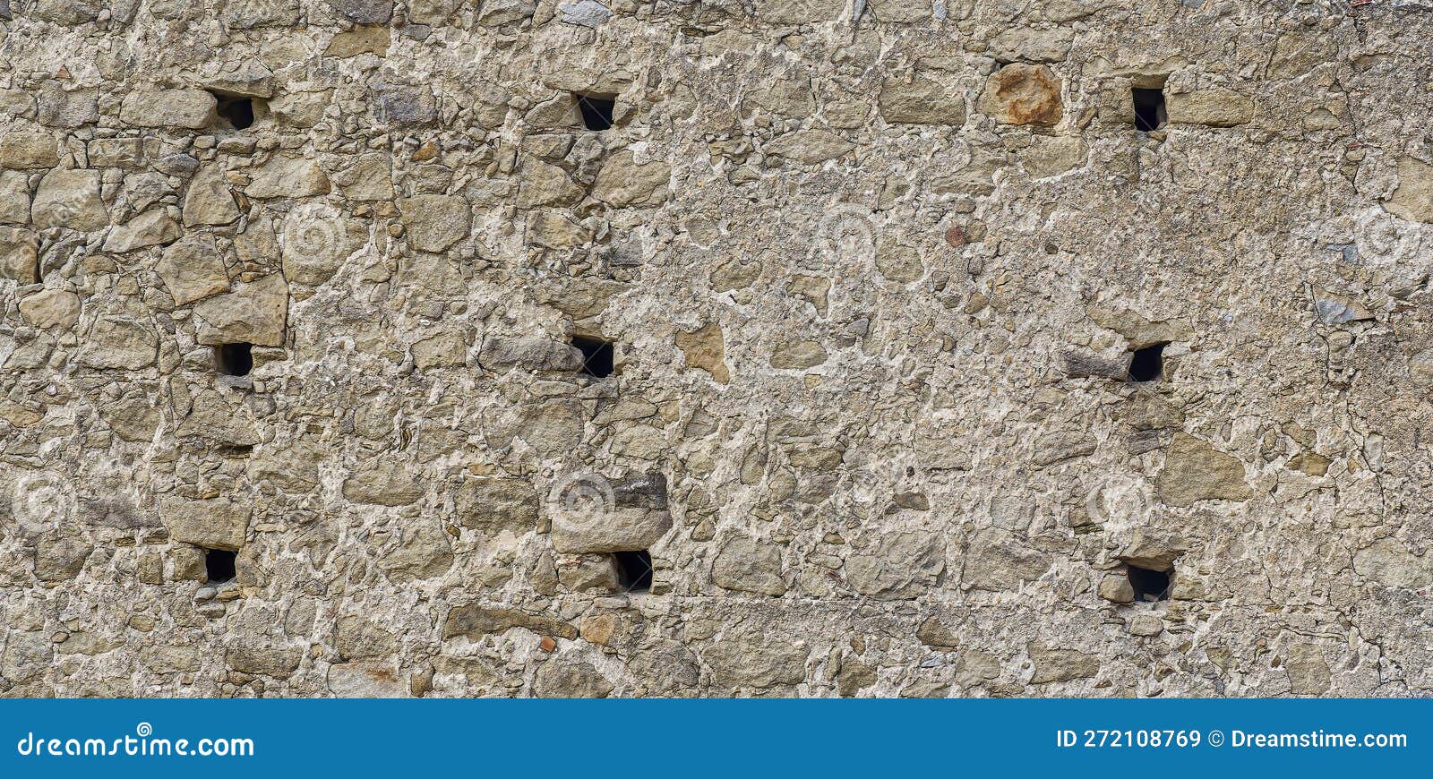 gray monochrone texture of an anciant old castle wall with little windows embrasures