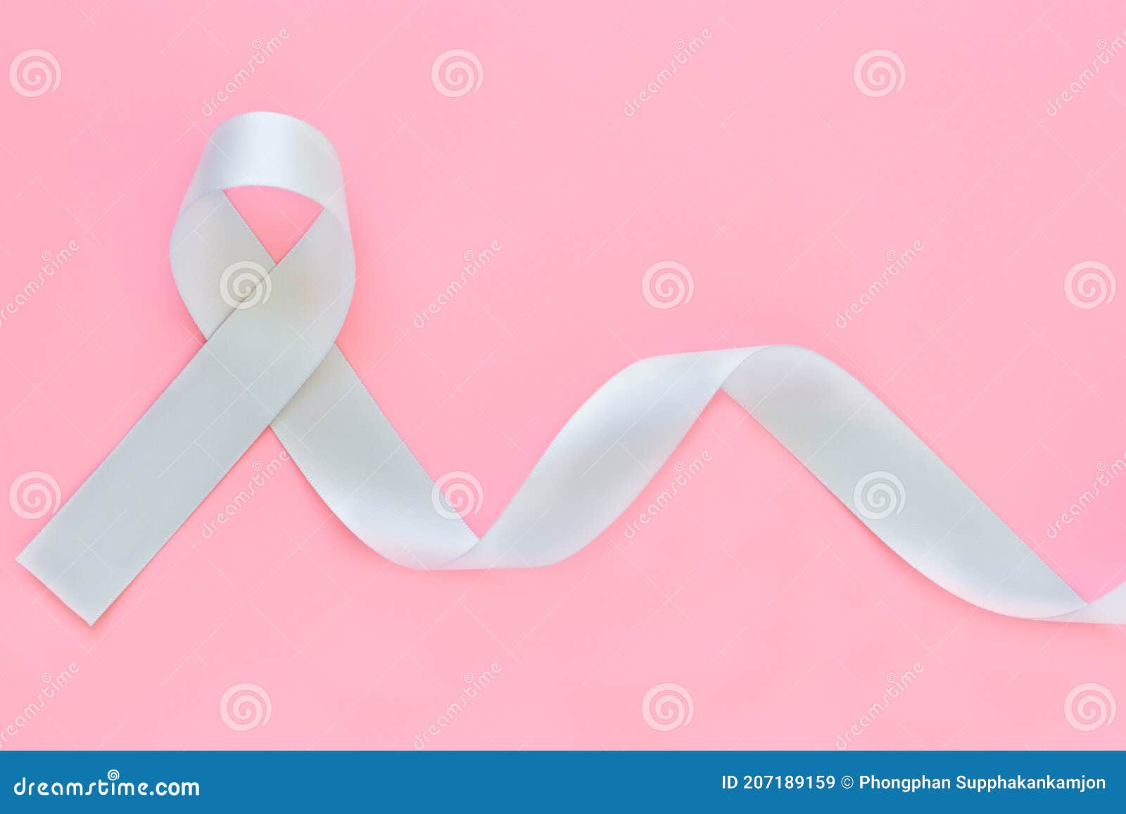 gray ribbon on pink  background copy space. brain cancer awareness, brain tumors, allergies, asthma, diabetes awareness,