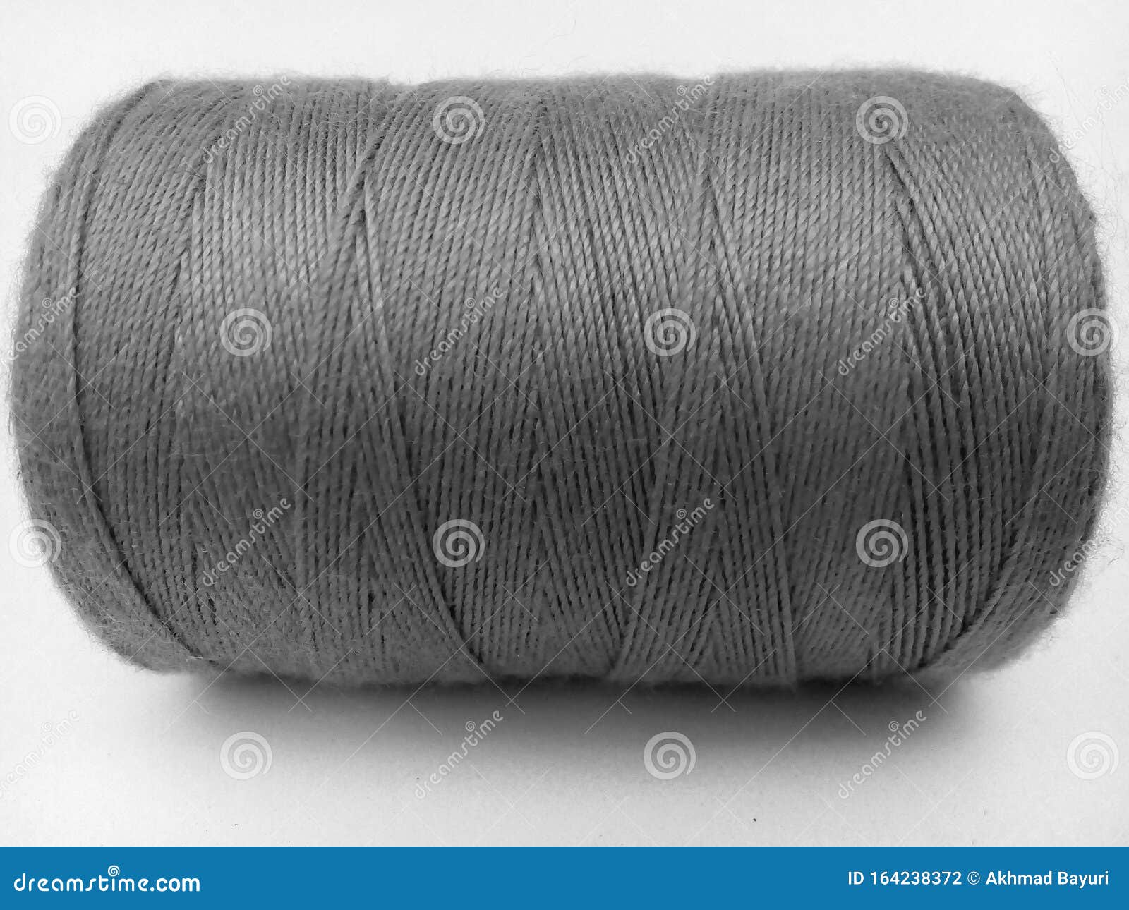 Gray Sewing Thread Roll with an Isolated White Background Stock Photo