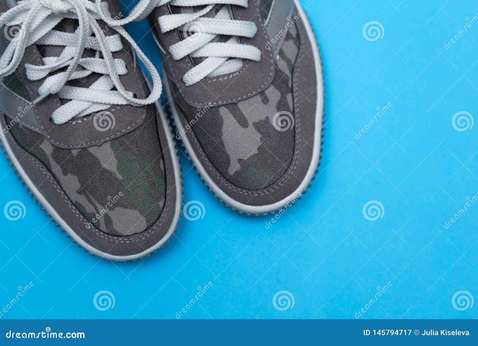 Gray Sneakers on a Blue Background Stock Image - Image of health ...