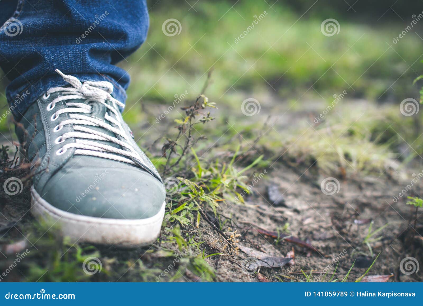 Gray Sneakers on the Grass Outside the City Stock Image - Image of ...