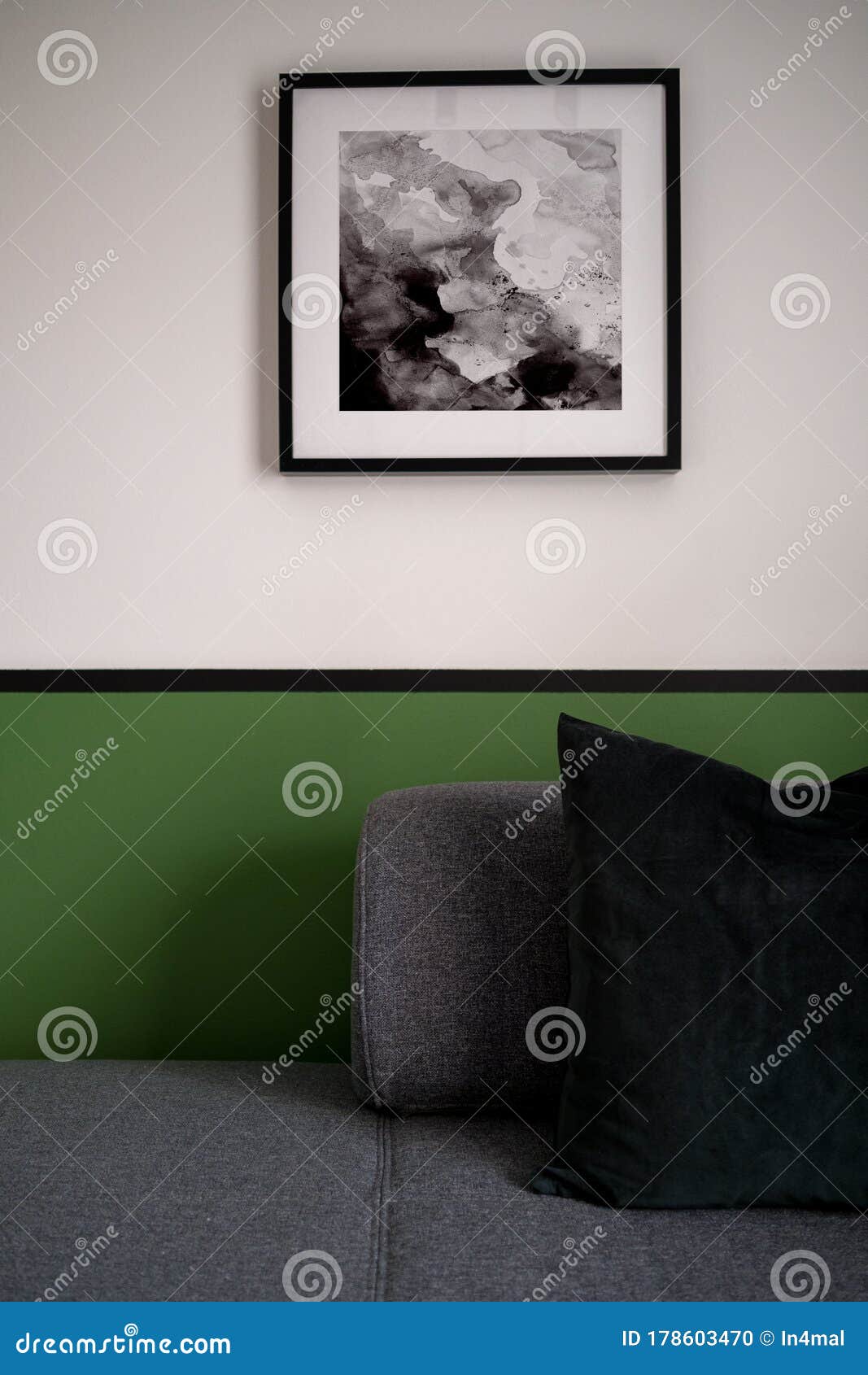 Gray sofa and green wall stock photo. Image of pillow 178603470