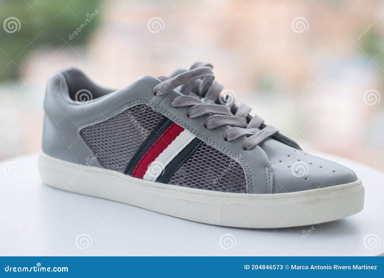 A Gray Tommy Hilfiger Shoe with Stripes Editorial Stock Photo - Image ...