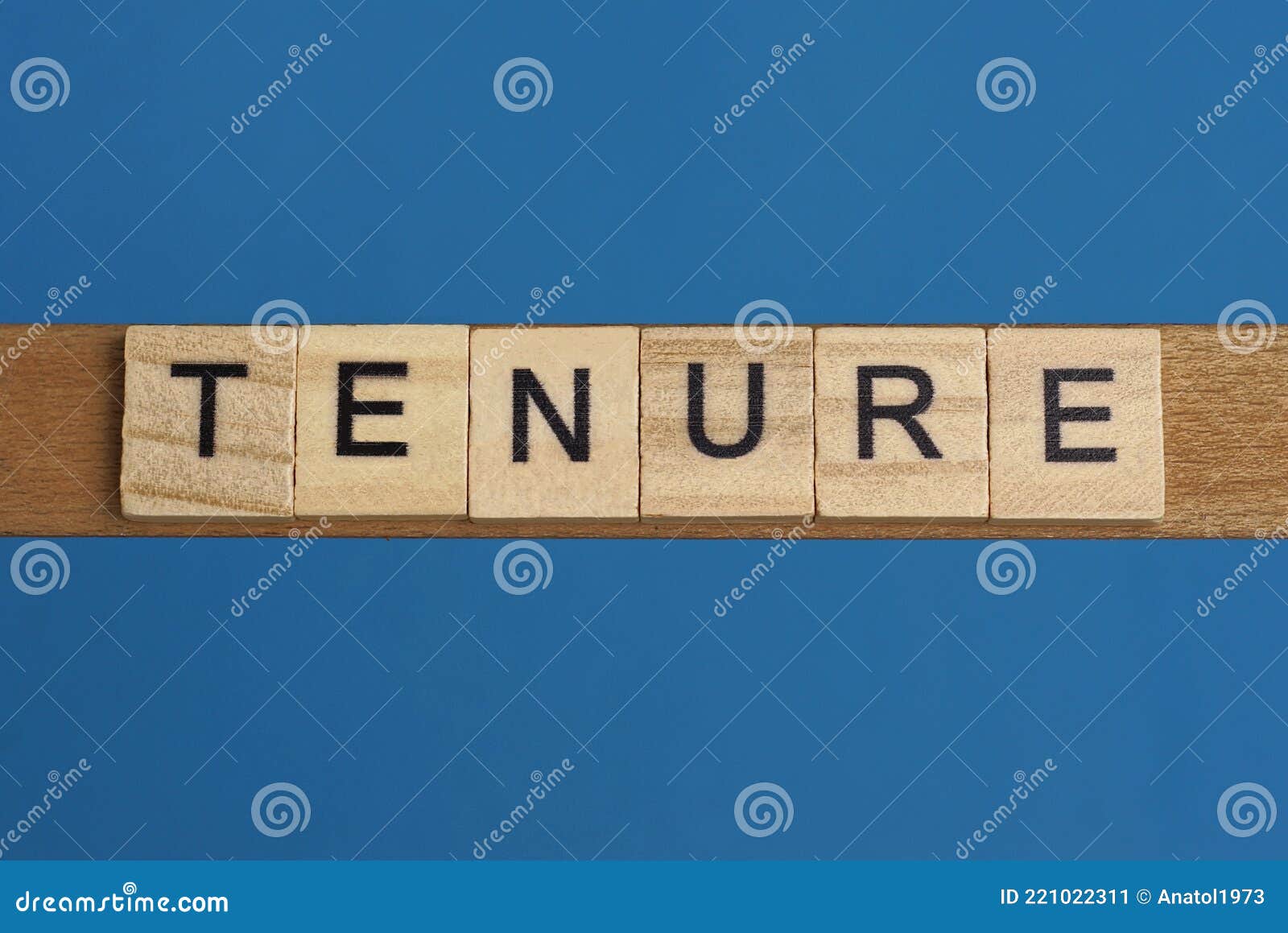 gray word tenure in small square wooden letters