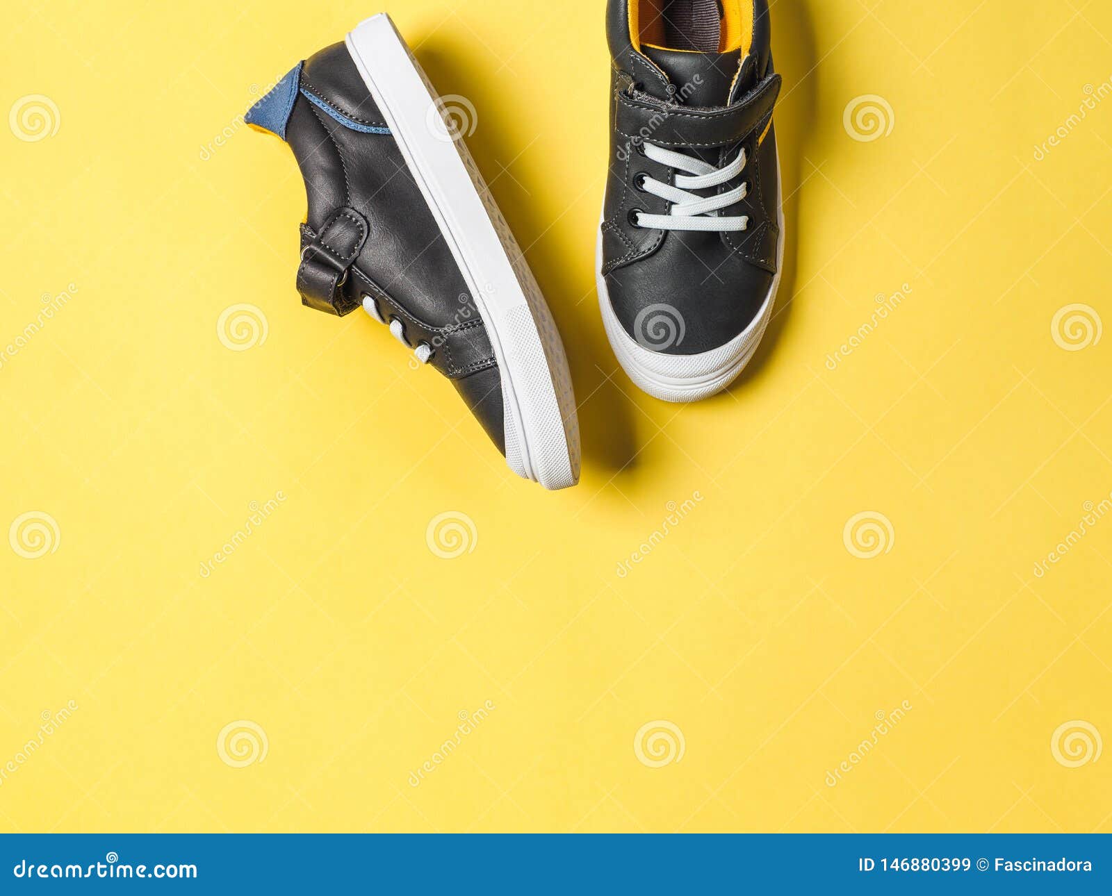 Gray And Yellow Sneakers On Yellow Background Stock Image - Image of ...