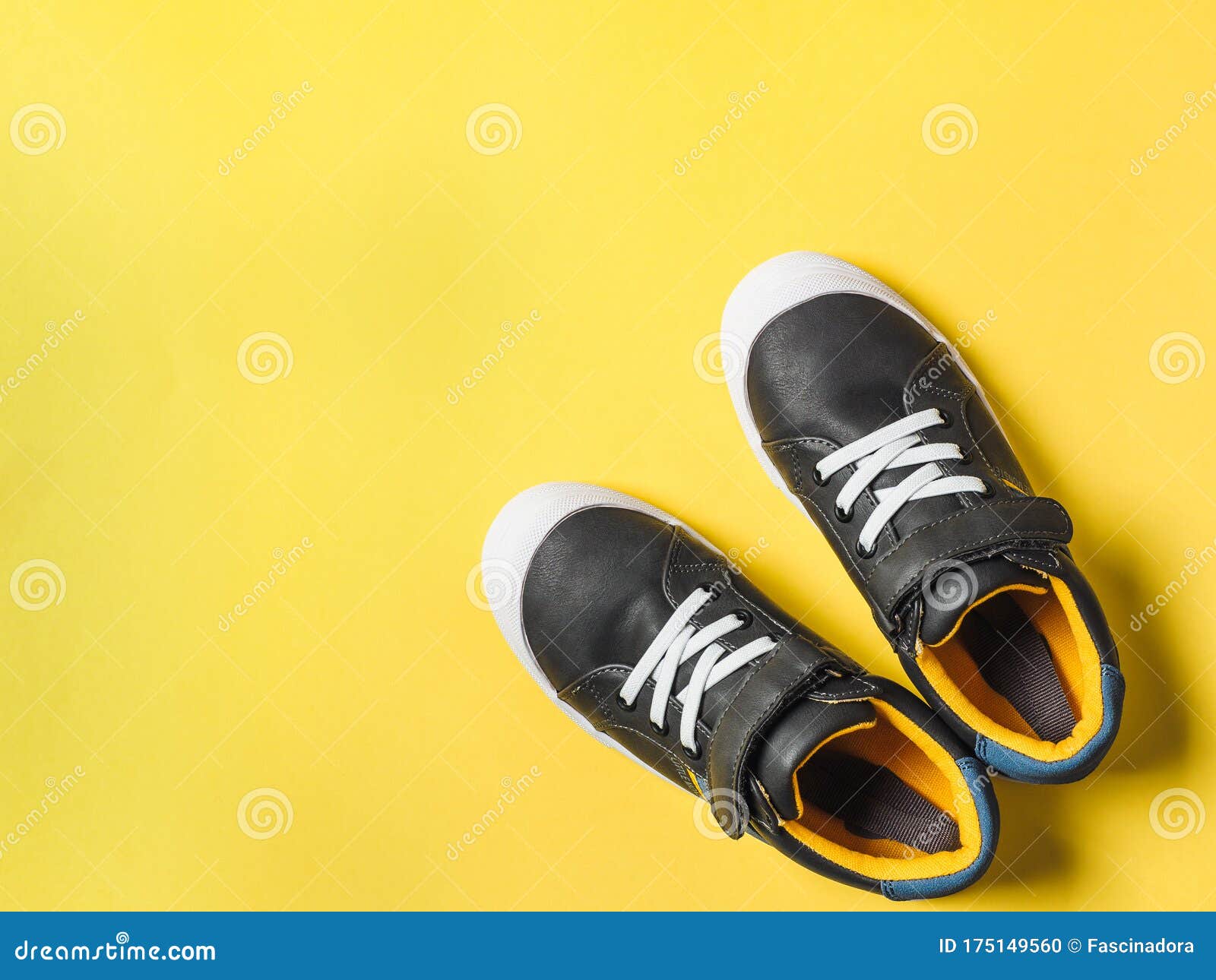 Gray and Yellow Sneakers on Yellow Background Stock Photo - Image of ...