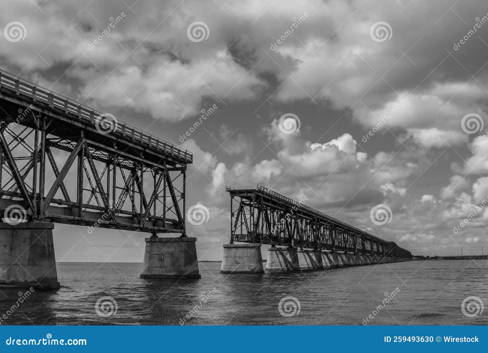 grayscale of a bridge in maraton, keys island, florida under a cloudy sky