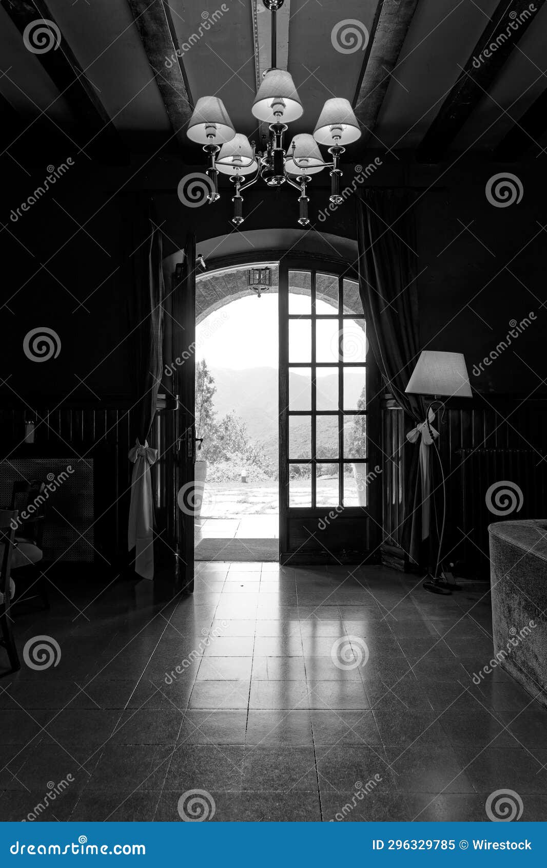 Grayscale of a Hallway with a Halfopen Door Stock Image Image of