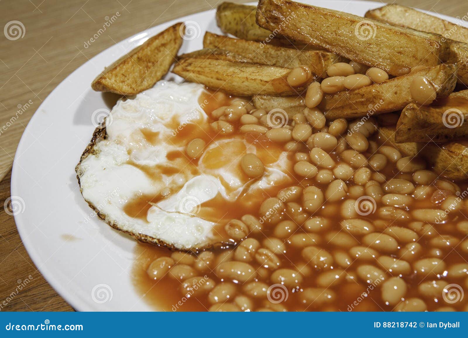 Greasy Cafe Meal of Egg Beans and Chips. Poorly Presented Food. Stock