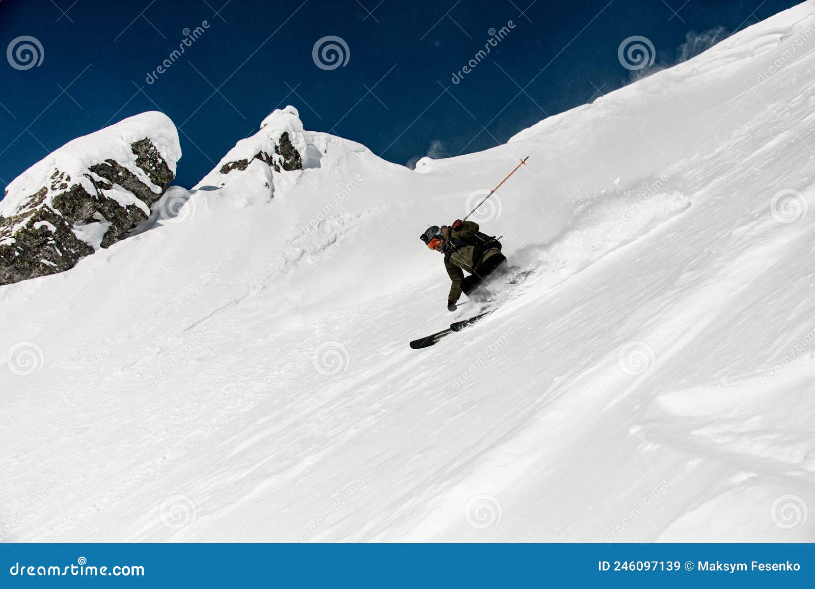 Great View on Male Skier Slides Down the Snow-covered Slope. Freeride ...
