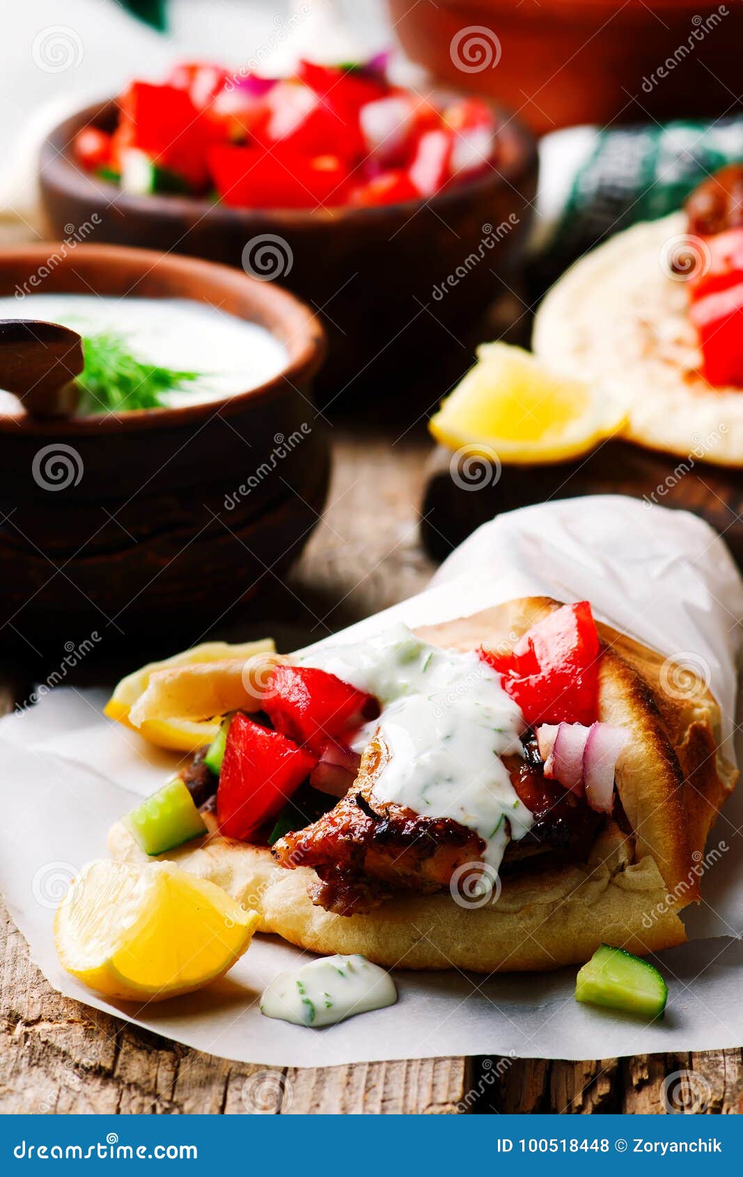Greek Chicken Gyros with Tzatziki Stock Photo - Image of wooden ...