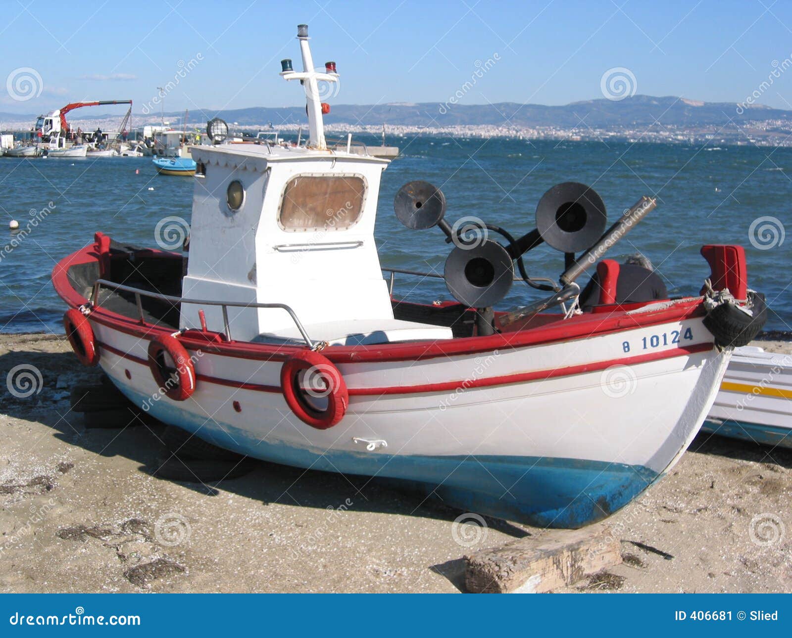 Aerial view of small fishing boat at sea, Greece. Stock Photo by nblxer