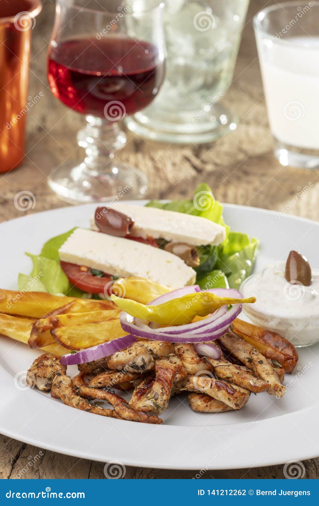 Greek gyros on a plate stock photo. Image of fries, meat - 141212262