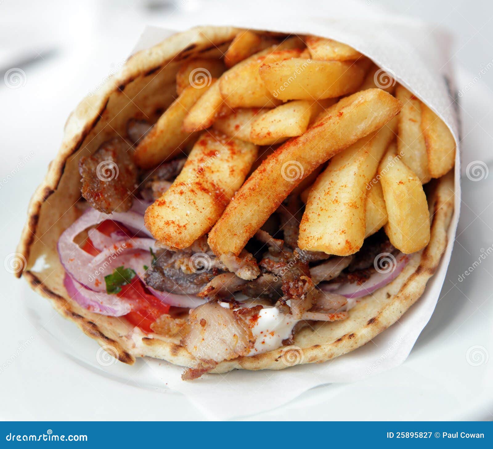 Greek pork souvlaki wrap stock image. Image of onion 25895827